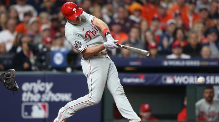 Oct 29, 2022; Houston, Texas, USA; Philadelphia Phillies catcher J.T. Realmuto (10) hits a single during the eighth inning against the Houston Astros in game two of the 2022 World Series at Minute Maid Park.